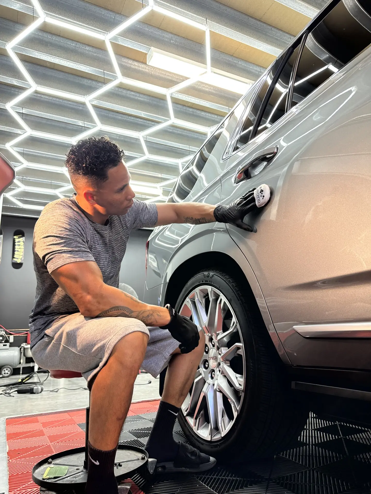 Ceramic coating being applied to a silver SUV at LXT Paint Protection on the Gold Coast